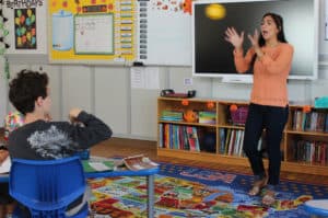 Ms. DiCanio leads an "emoji" exercise that reinforces positive behavior