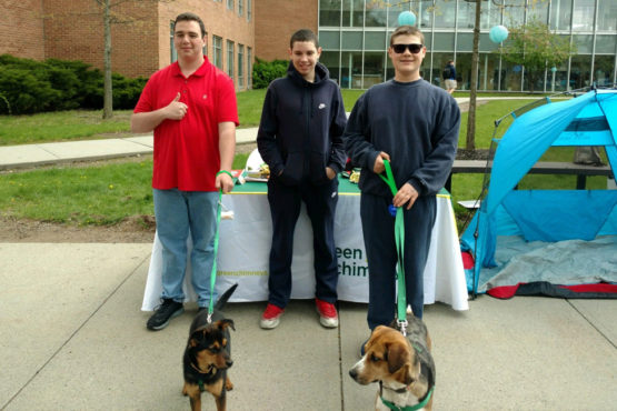 Image of Green Chimneys School students with rescue dogs at a community event