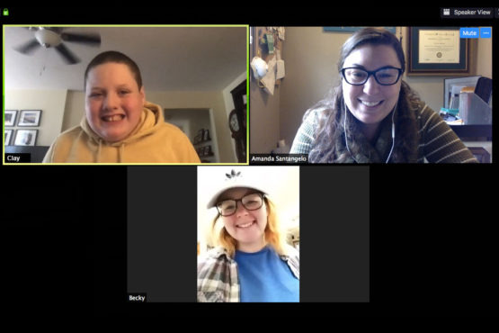 Image of student, speech-language pathologist, and intern connecting via zoom.