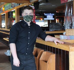 Images shows Green Chimneys student at Applebee's as part of his vocational education experience.