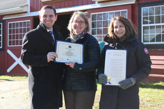 Assemblyman Matt Slater presents Green Chimneys staff with certificate of Historic Business Designation