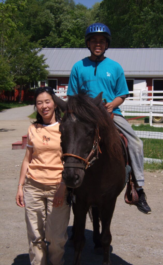 Author with Spadi the horse and a Green Chimneys student in 2008.